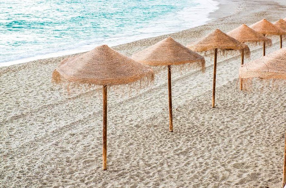 depositphotos_40706423-stock-photo-straw-parasols-on-empty-beach.jpg